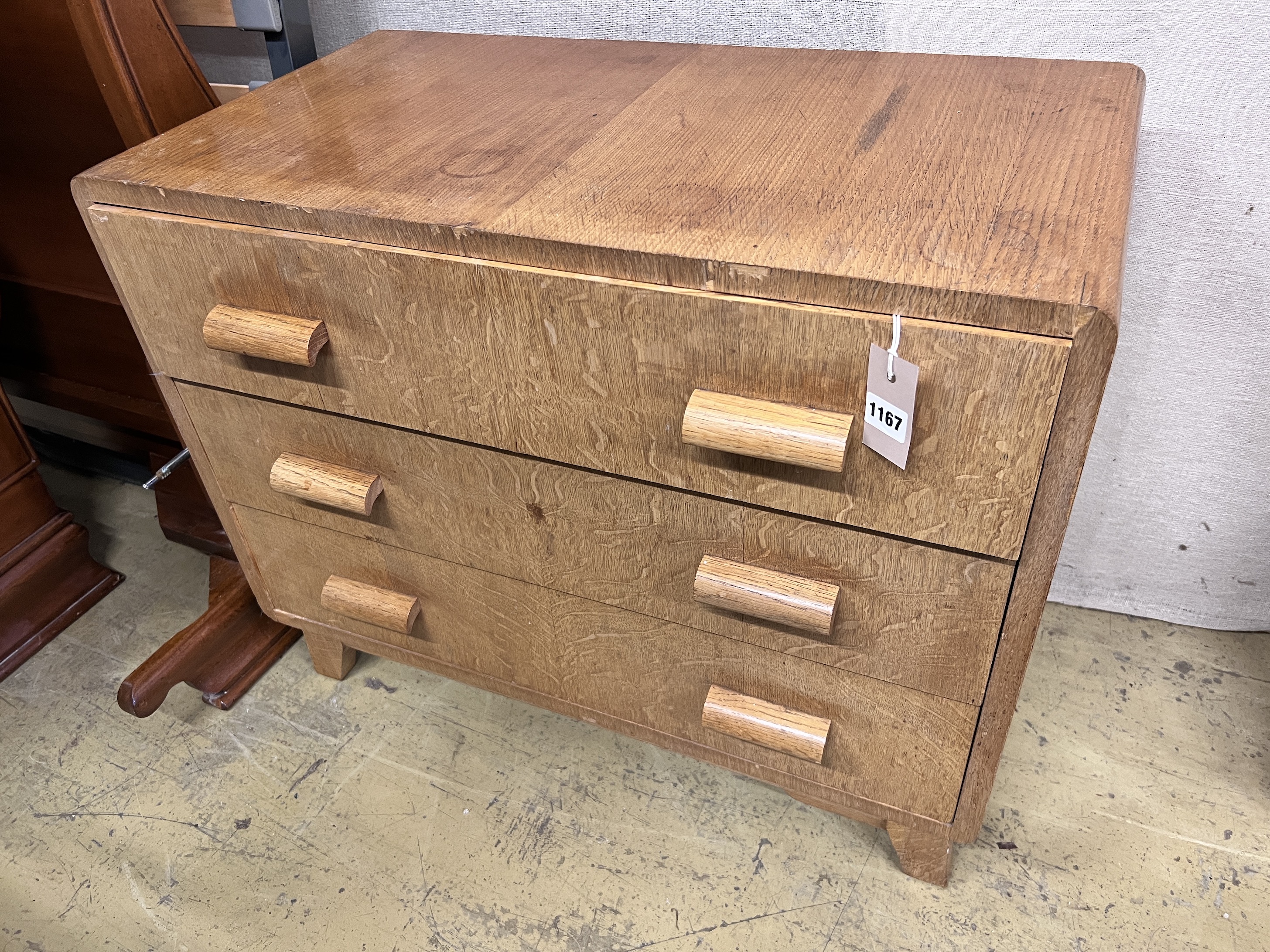 A mid century oak chest of three drawers by PE Gain, width 76cm